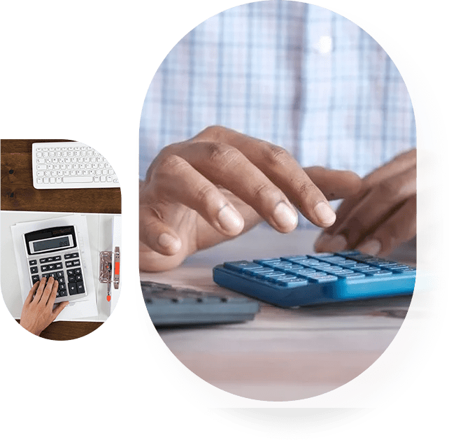 A person using a calculator on top of a table.