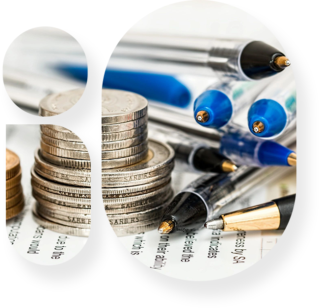 A close up of coins and pens on top of papers