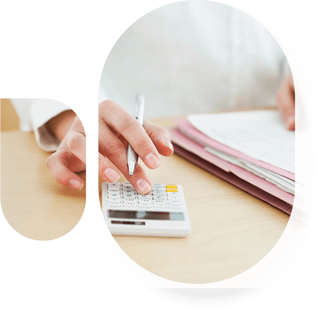 A person is using a calculator on the table