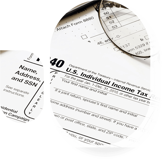 A close up of an irs form and glasses